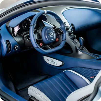 Figure → Bugatti Chiron interior leather and carbon fiber detailing showing pristine finish